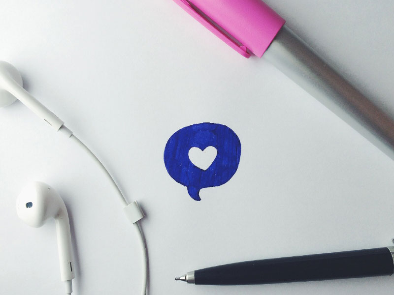 A doodle of a chat bubble with a heart.