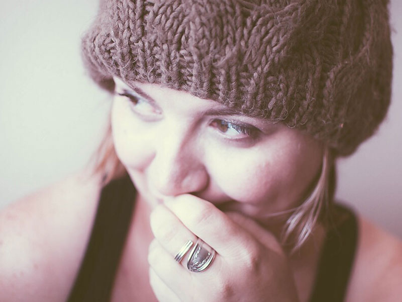 A woman taking a compliment from a man and looking happy.