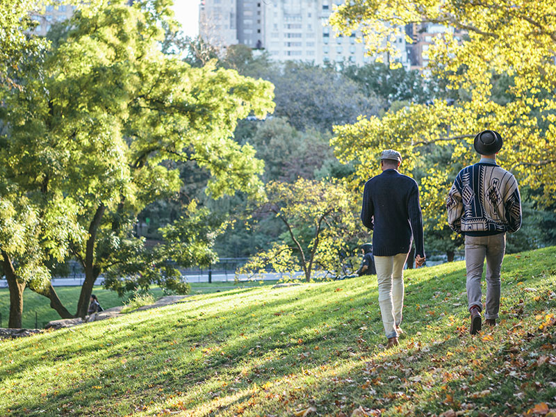 Two LGBT daters on a date in a park.