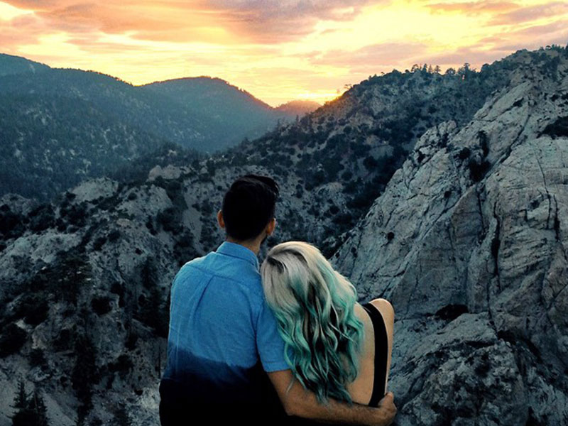 Two people looking at a sunset.