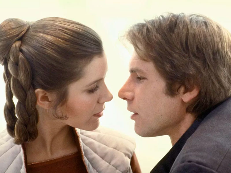 Princess Lei and Han Solo about to kiss.