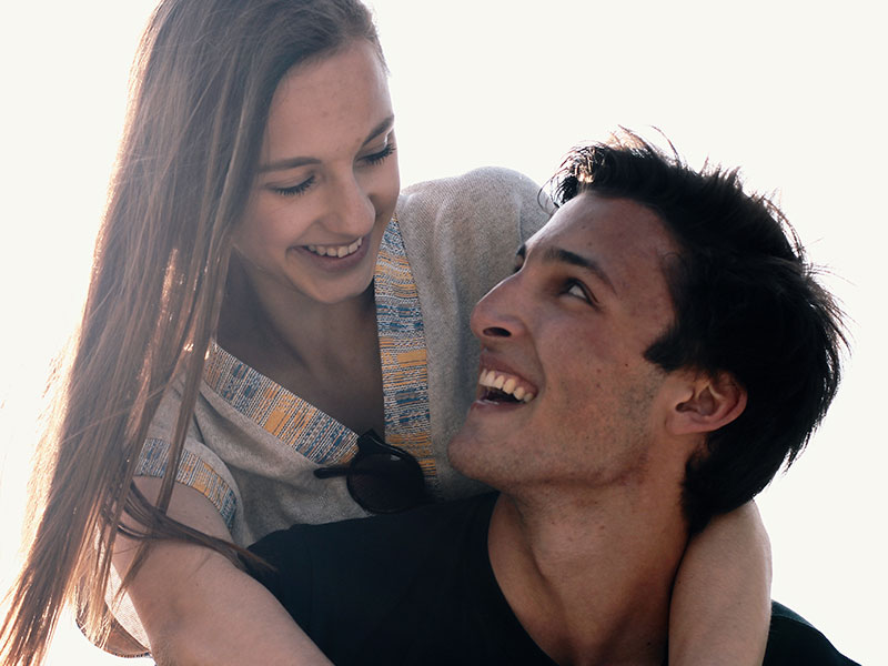 A girl who's definitely boyfriend material with her boyfriend laughing and being happy.