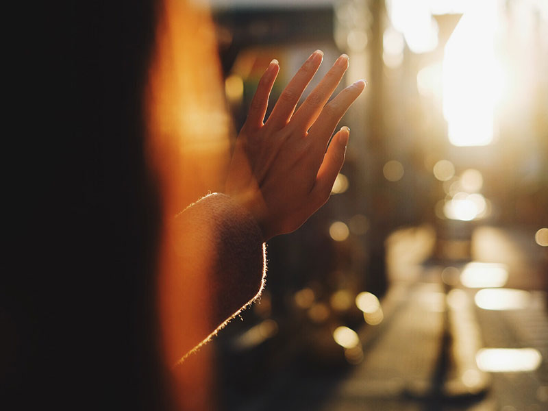 A woman listening to songs about missing someone after looking for I miss you songs.