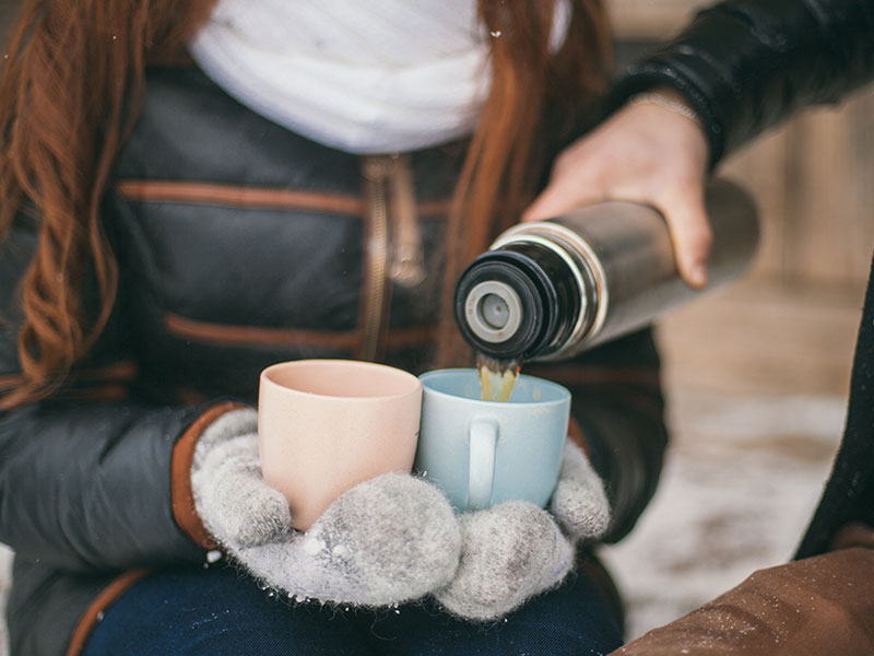 A woman who is 40 and single getting some coffee from a man.
