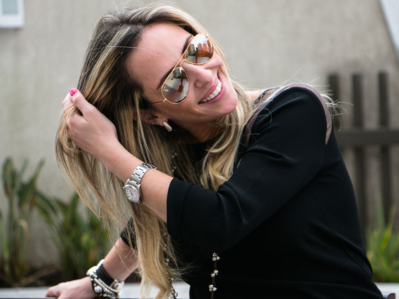 A woman dating over 40 running her fingers through her hair.