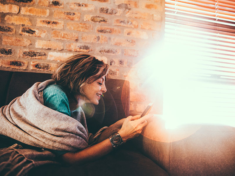 A woman who's new to online dating setting up her profile.