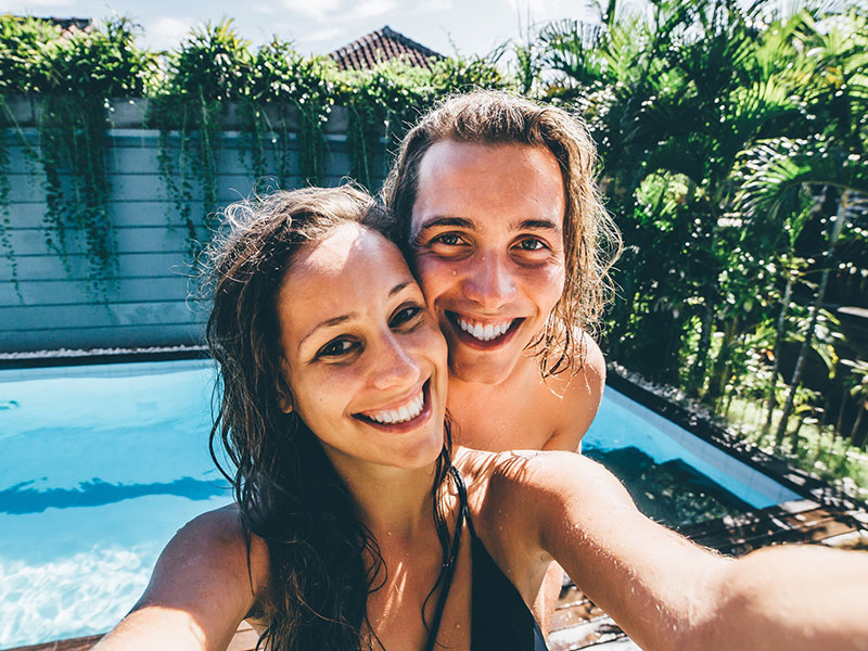 A girl and her boyfriend taking a selfie together.