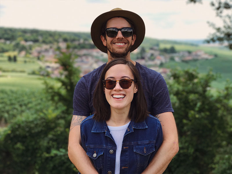 A couple in an INTJ relationship hugging and smiling together.