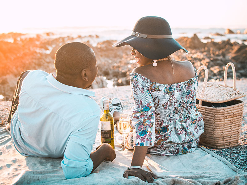 A couple who learned about these dating statistics from 2018 on a date at sunset.