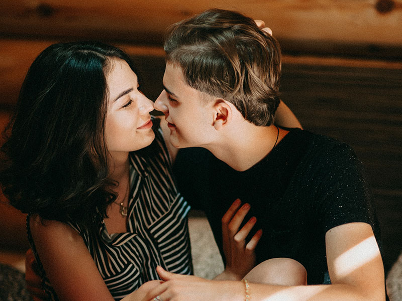 A girl who learned how to date in a small town about to kiss a guy on their first date.