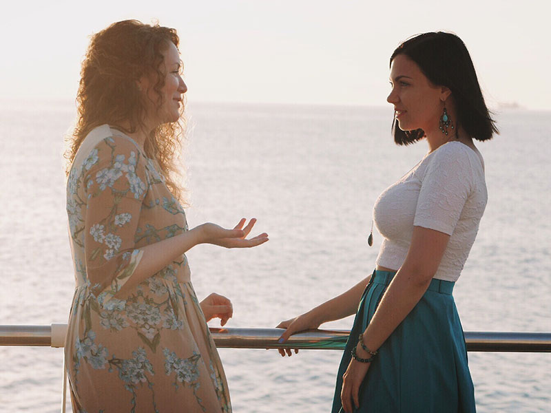 Two women having a serious conversation.