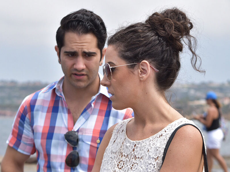 A guy and a girl fighting a bit on a bad first date.