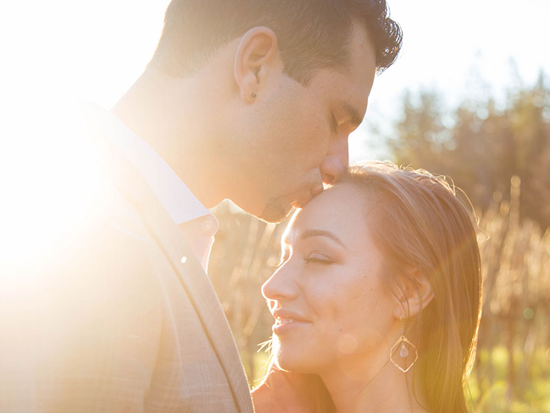 A guy who learned how to get a girl to you like you, kissing the head of the girl he's really into.