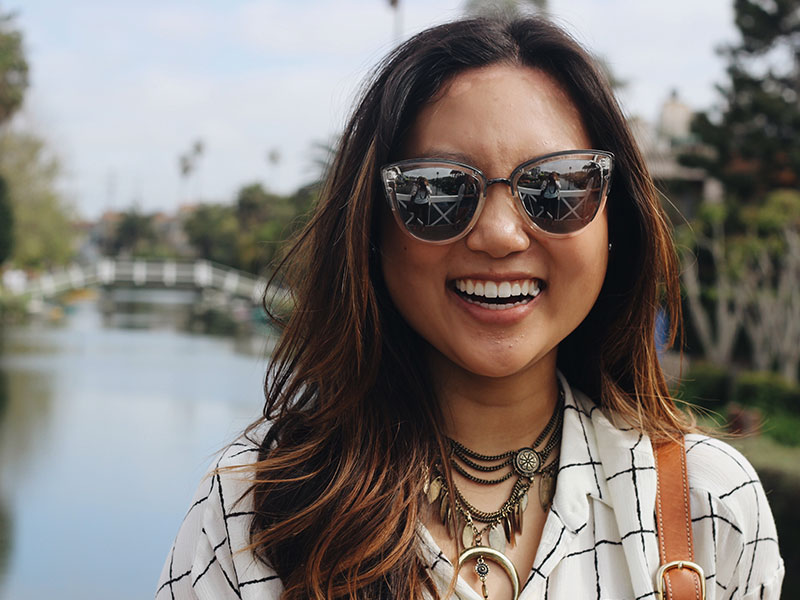 A girl laughing as the guy taking the picture wonders, "Why don't girls like me?"