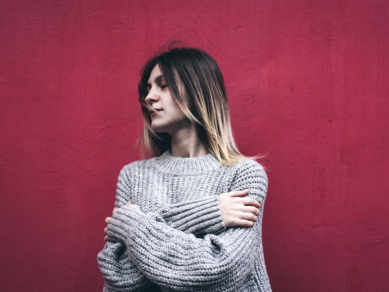 Woman looking pensive after being told by her partner that I love you but I'm not in love with you