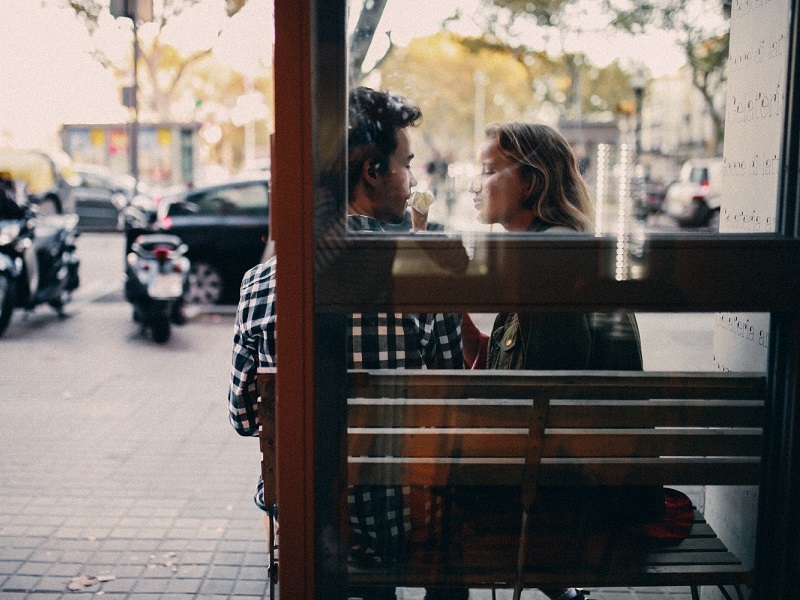 an attractive couple eating ice cream and showing how to start dating again
