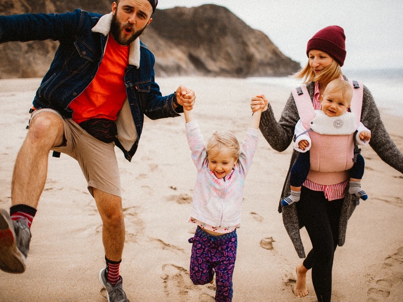 a man walking a man walking on a beach dating a woman with kids