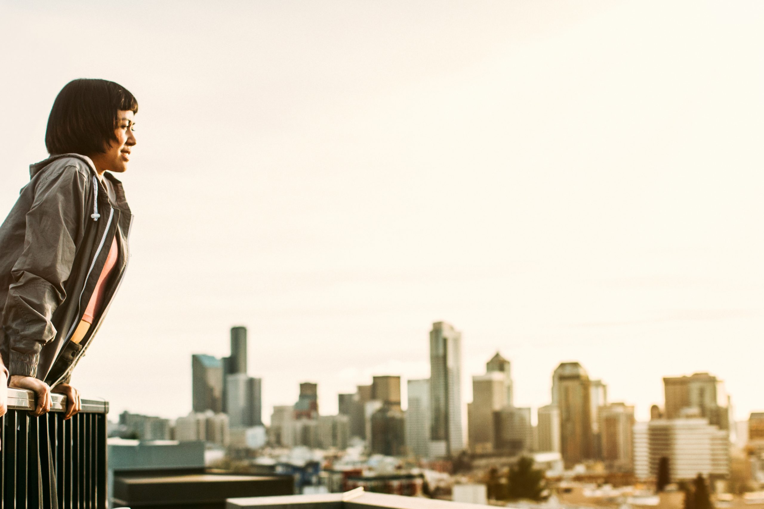 Single women looking out over city and thinking about dating in Seattle