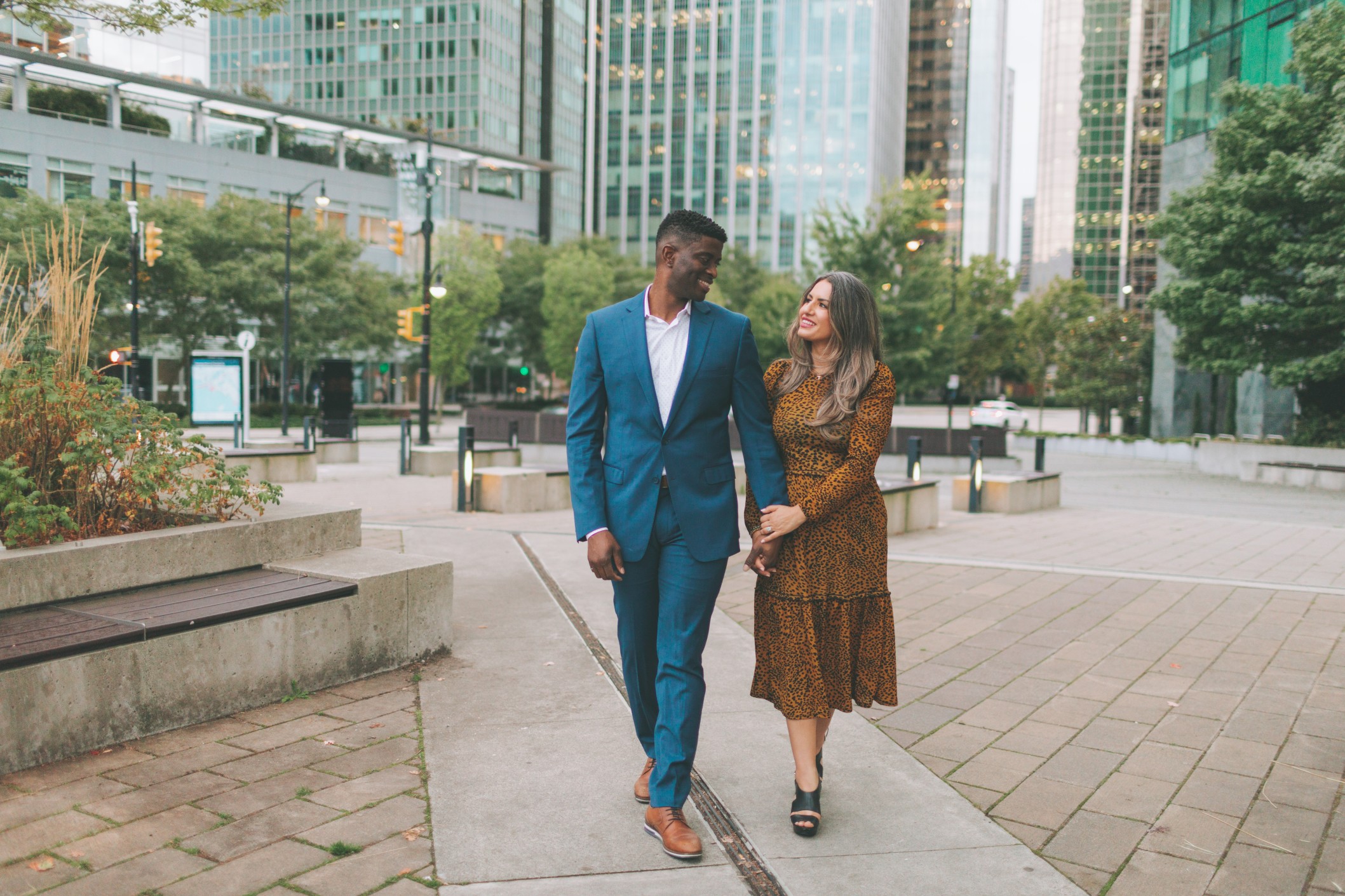 happy, interracial couple walking in the streets of Philadelphia