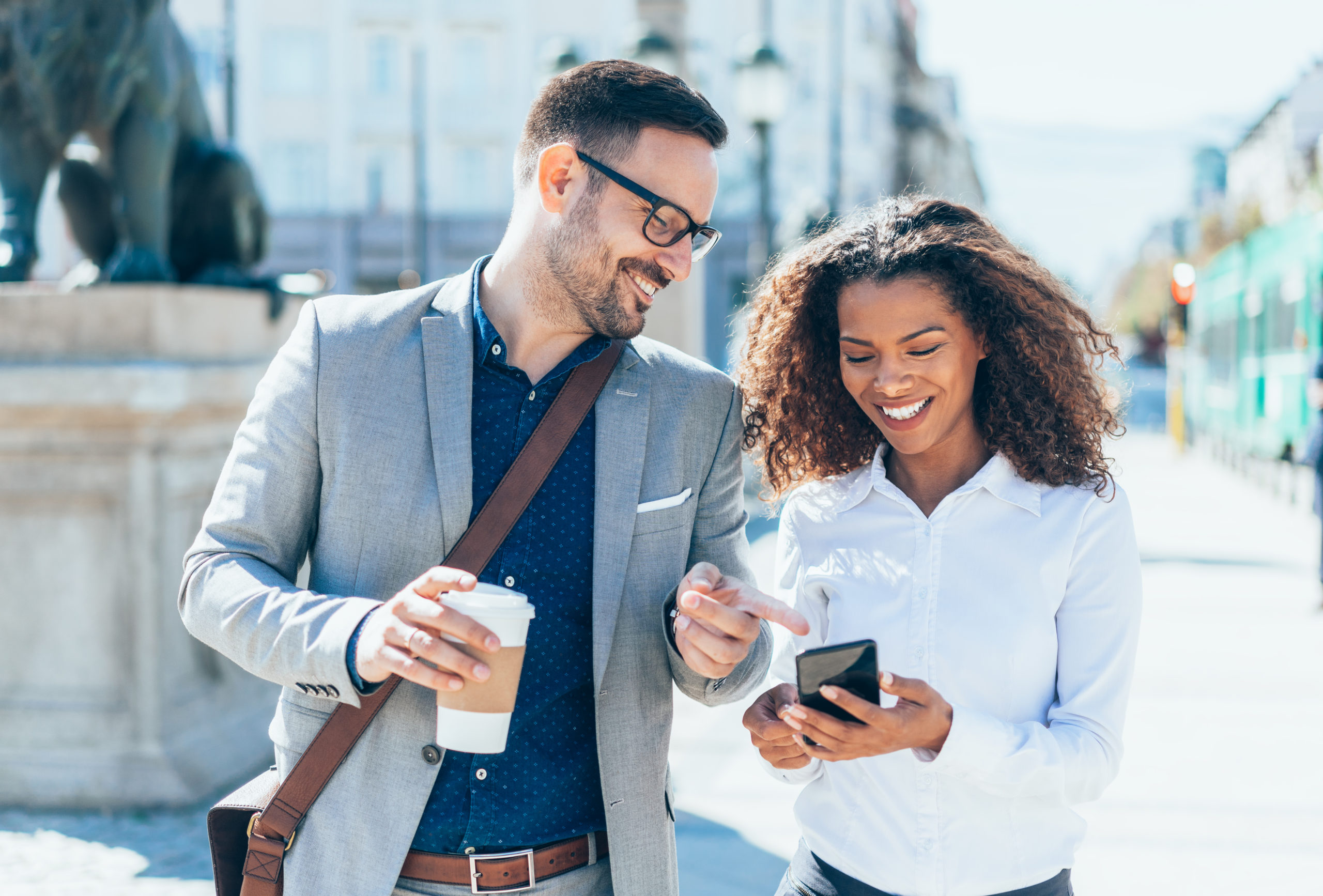professional couple walking on date laughing