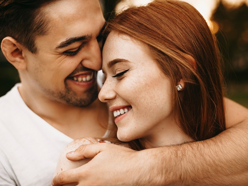 close up of loving couple holding each other